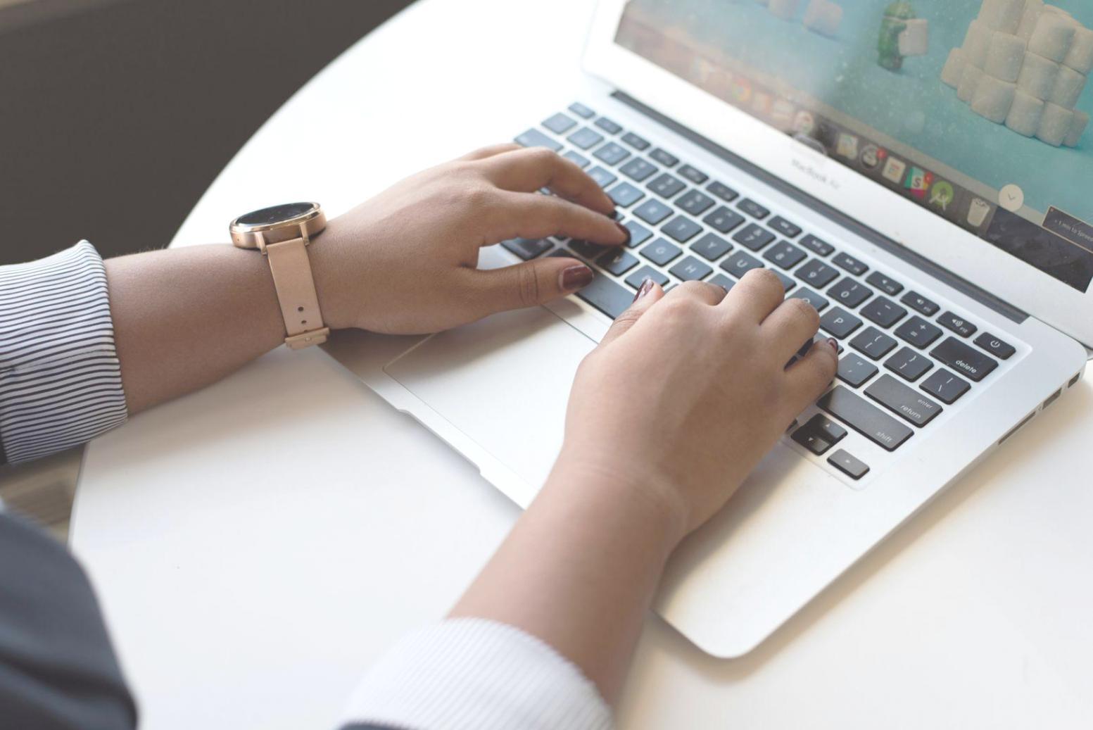 Financial professionals working with budget compliance documents and digital analysis tools